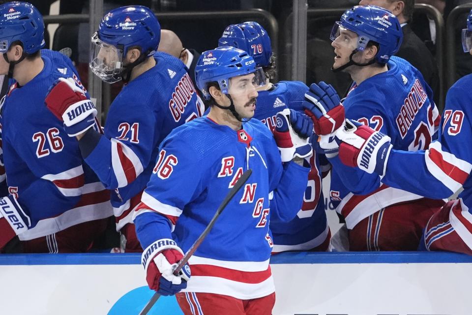 New York Rangers' Vincent Trocheck (16) celebrates with teammates after scoring during the third period of an NHL hockey game against the Vancouver Canucks, Monday, Jan. 8, 2024, in New York. (AP Photo/Frank Franklin II)