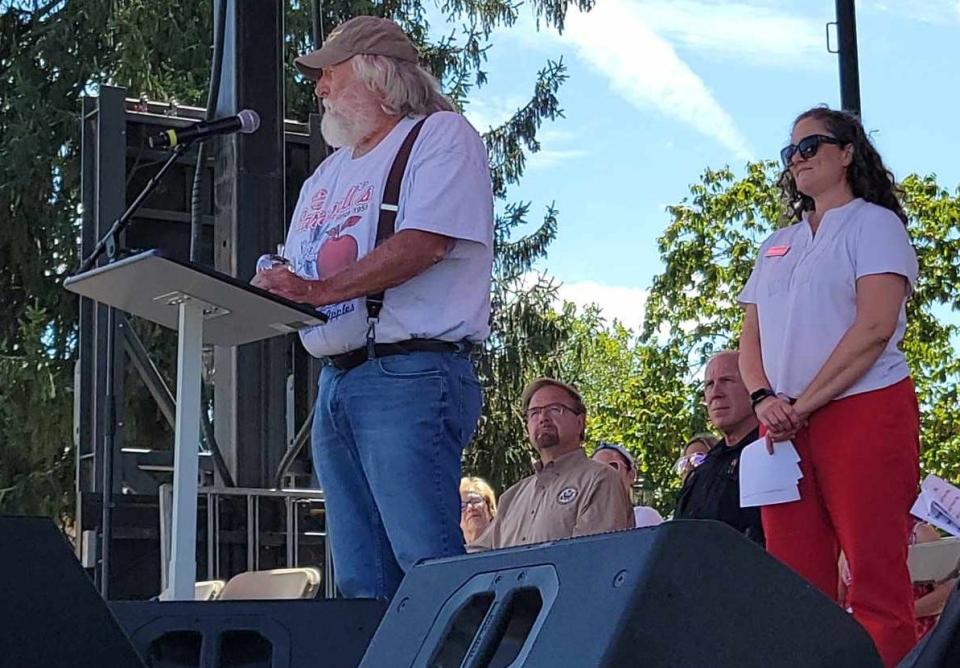 Wayne Barnwell with Odell Barnwell & Sons and Barnwells Apple House was named the Farmer of the Year on the opening day of the 77th North Carolina Apple Festival on Sept. 1 in downtown Hendersonville. Behind Barnwell is United Community Bank's Fair Nabers Waggoner.