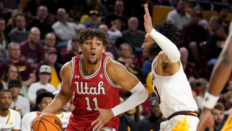 Utah's Wilguens Jr. Exacte (35) drives the baseline against Arizona State's Frankie Collins (10) during game, Saturday, Feb. 18, 2023, in Tempe, Ariz.