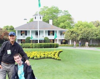 Taylor Parrott and his father Chip got a photo taken in front of the Augusta National clubhouse. (Courtesy of Parrott family)