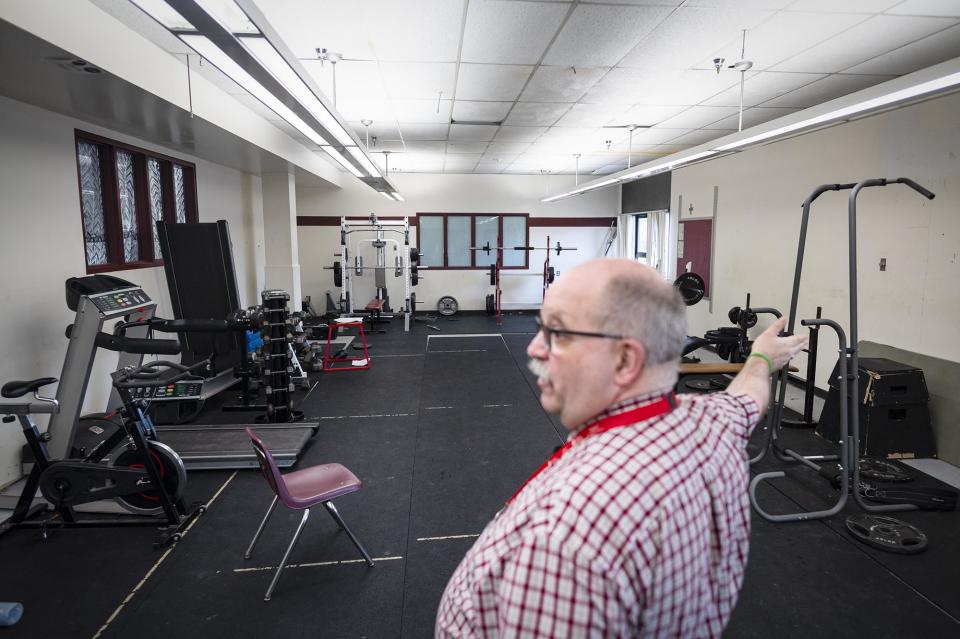 John Tague, superintendent for the Franklin West Supervisory Union, shows a weight room at BFA-Fairfax. The area is one of many at the school that will be renovated thanks to a recently passed bond. (Glenn Russell/VTDigger)