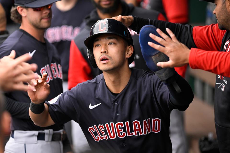 Guardians outfielder Steven Kwan is congratulated in the dugout after scoring a run in the first inning of Monday's 10-7 win over the Kansas City Royals.