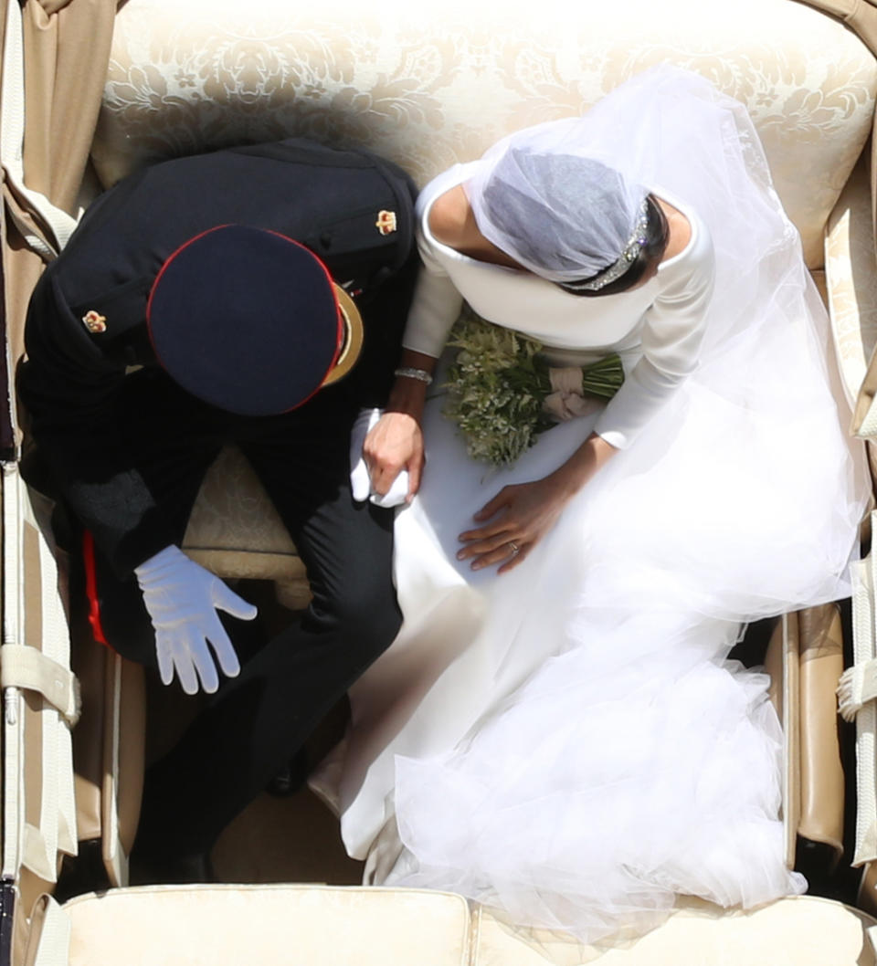 <p>This shot of the couple in the carriage procession became one of the iconic images of the day. (Yui Mok - WPA Pool/Getty Images)</p> 