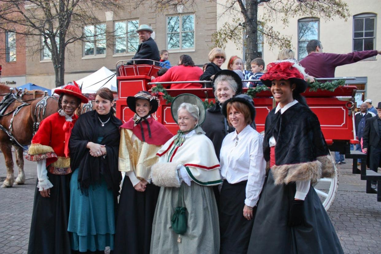 People in costume celebrate A Dickens Holiday in 2008.