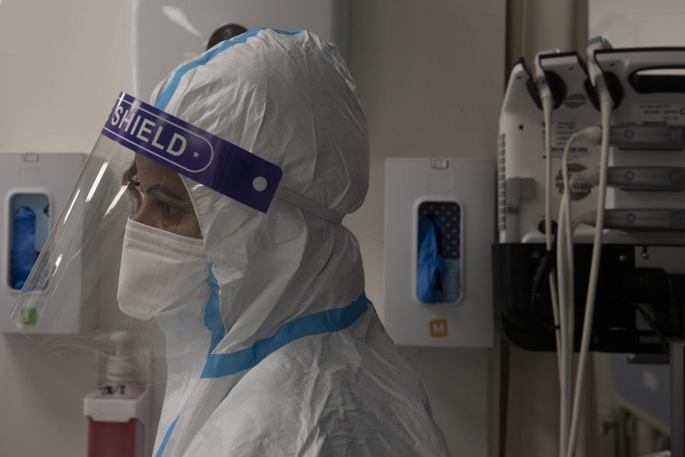 A medical professional in protective equipment takes a short break, in the coronavirus ward of the Shaare Zedek Medical Center, in Jerusalem, Tuesday, Aug. 31, 2021. (AP Photo/Maya Alleruzzo),