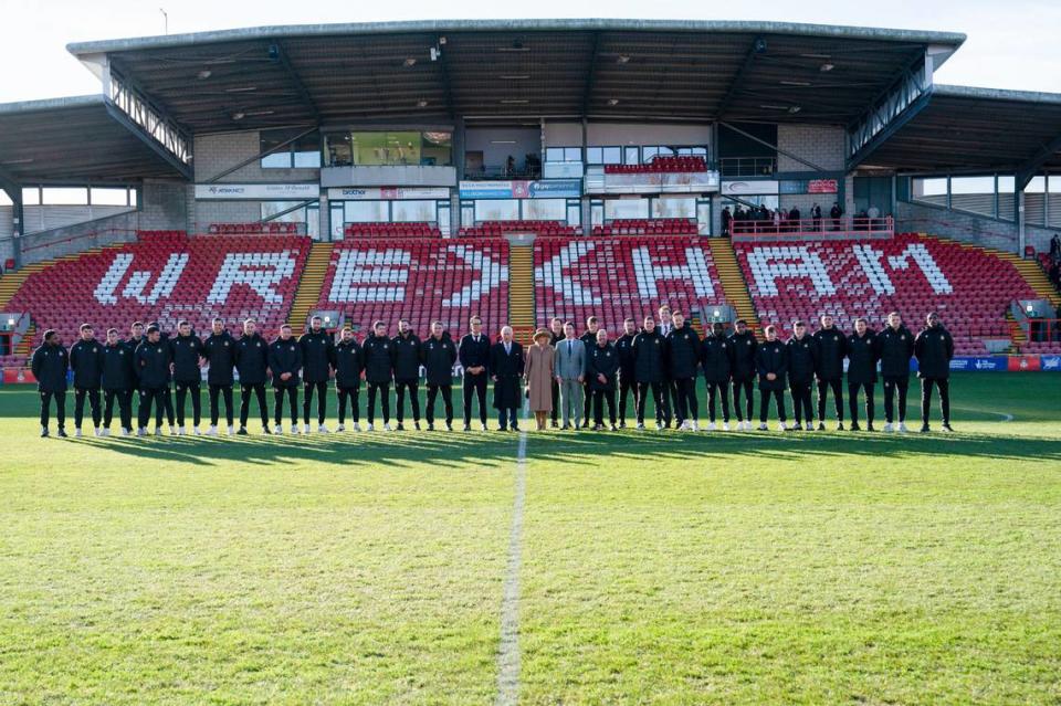 Britain’s King Charles III and Camilla, the Queen Consort meet Wrexham Soccer team co owners, US actors Ryan Reynolds and Rob McElhenney and players during their visit to Wrexham Association Football Club’s Racecourse Ground, in Wrexham, England, Friday, Dec. 9, 2022.