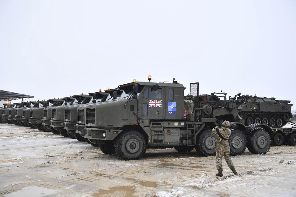 Tanks uploaded on military truck platforms as a part of additional British troops and military equipment arrive at Estonia's NATO Battle Group base in Tapa, Estonia, Friday, Feb. 25, 2022. With Ukrainian President Volodymyr Zelenskyy appealing for help, NATO members ranging from Russia’s neighbor Estonia in the north down to Bulgaria on the Black Sea coast triggered urgent consultations about their security. (AP Photo/Sergei Stepanov)