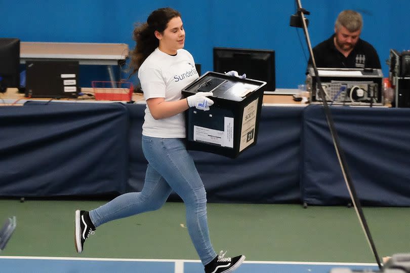 Ballot boxes are run in during the general election results count in Sunderland