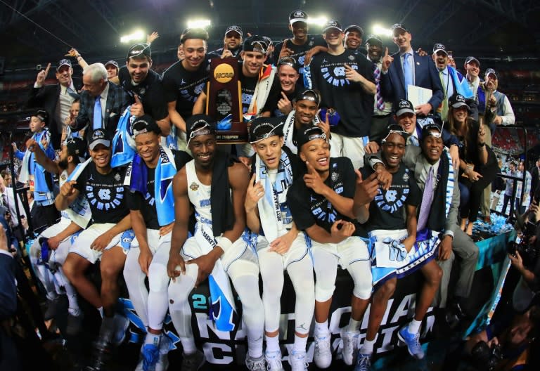 The North Carolina Tar Heels celebrate after defeating the Gonzaga Bulldogs during the 2017 NCAA Men's Final Four National Championship game, at University of Phoenix Stadium in Glendale, Arizona, on April 3