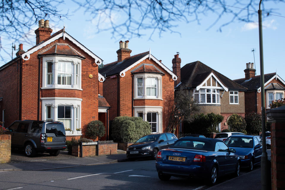 WEYBRIDGE, ENGLAND  - FEBRUARY 12: A row of houses stand on a residential street on February 12, 2018 in Weybridge, United Kingdom. Surrey County Council have approved the highest possible increase in council tax as they face a reported £105M gap in their finances over the next year. Nearly all other local authorities across the country also plan to increase council tax amid financial concerns. (Photo by Jack Taylor/Getty Images)