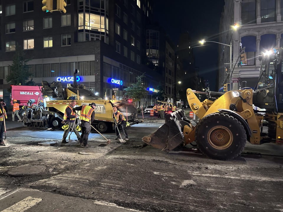 Team of workmen repaving sixth avenue at night, Manhattan, New York. (Photo by: Lindsey Nicholson/UCG/Universal Images Group via Getty Images)