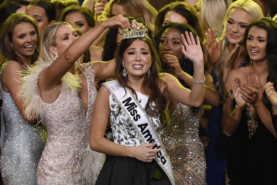 Miss Alaska Emma Broyles, center, reacts after being crowned Miss America at Mohegan Sun, Thursday, Dec. 16, 2021, in Uncasville, Conn. (AP Photo/Jessica Hill)