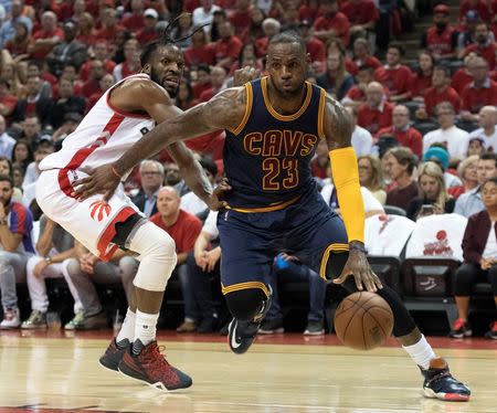 May 27, 2016; Toronto, Ontario, CAN; Cleveland Cavaliers forward LeBron James (23) drives to the basket as Toronto Raptors forward DeMarre Carroll (5) tries to defend during the third quarter of game six of the Eastern conference finals of the NBA Playoffs at Air Canada Centre. Mandatory Credit: Nick Turchiaro-USA TODAY Sports