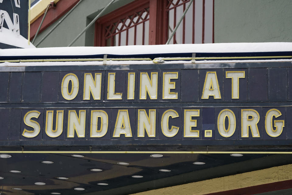 FILE - The marquee of the Egyptian Theatre appears in Park City, Utah on Jan. 28, 2021. The Sundance Film Festival is cancelling its in-person festival and reverting to an entirely virtual edition due to the current coronavirus surge. Festival organizers announced Wednesday, Jan 5, 2022, that the festival will start as scheduled on Jan. 20, but will shift online. Last year's Sundance was also held virtually because of the pandemic. (AP Photo/Rick Bowmer, File)