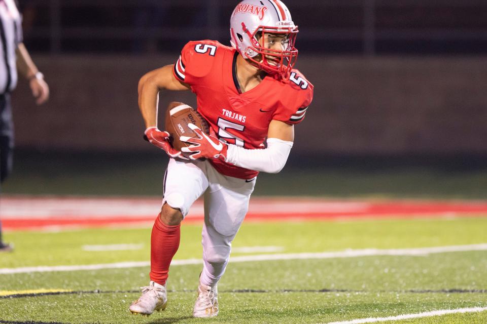  Trojans Tyrone De loney (5) takes the kickoff back for good yardage during Fridays game against the St. Mary’s Rams at Alex G. Spanos Stadium. Dianne Rose/For The Record