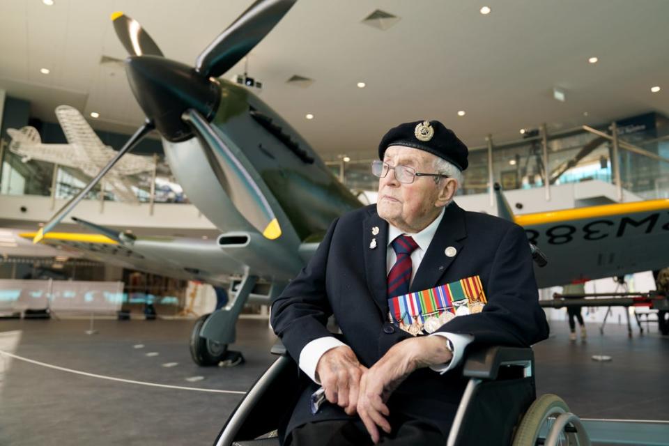 Veteran Norman Lewis, 102, beside the newly restored Spitfire (Jacob King/PA) (PA Wire)