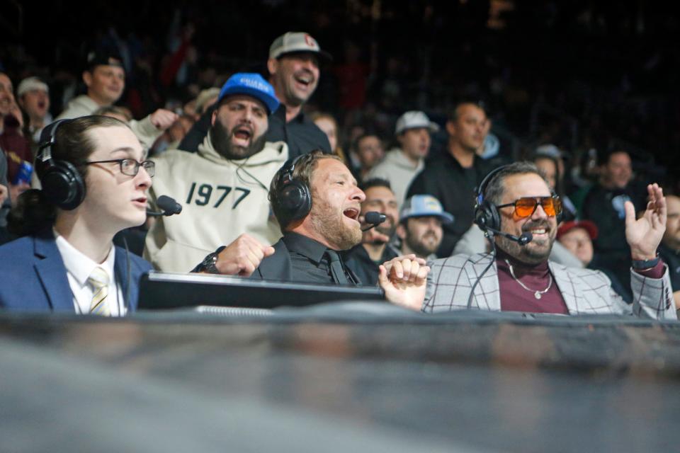 Barstool Sports' Robbie Fox, left, Dave Portnoy and Dan "Big Cat" Katz react during the opening match of Friday's Rough N Rowdy event in Providence, which made its return after a three-year absence.