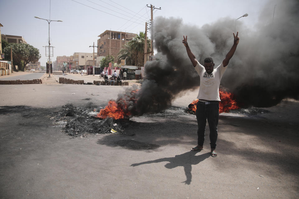 People burn tires during a protest a day after the military seized power Khartoum, Sudan, Tuesday, Oct. 26, 2021. The takeover came after weeks of mounting tensions between military and civilian leaders over the course and the pace of Sudan's transition to democracy. (AP Photo/Marwan Ali)