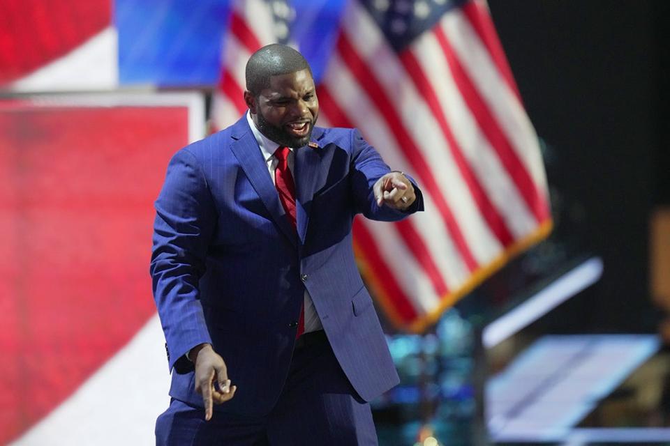 Rep. Byron Donalds, R-Fla. gestures on stage during the first day of the Republican National Convention. The RNC kicked off the first day of the convention with the roll call vote of the states.