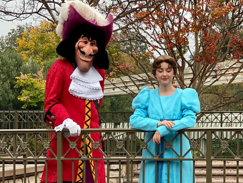 captain hook and wendy posing for a photo at disneyland