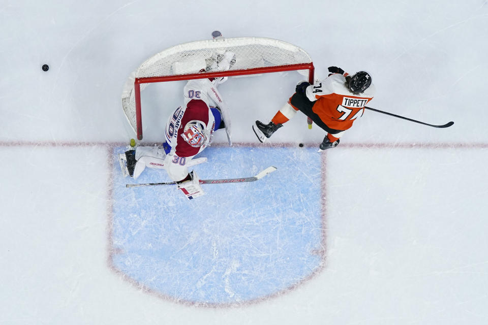 Philadelphia Flyers' Owen Tippett, right, collides with Montreal Canadiens' Cayden Primeau during overtime in an NHL hockey game, Wednesday, Jan. 10, 2024, in Philadelphia. (AP Photo/Matt Slocum)