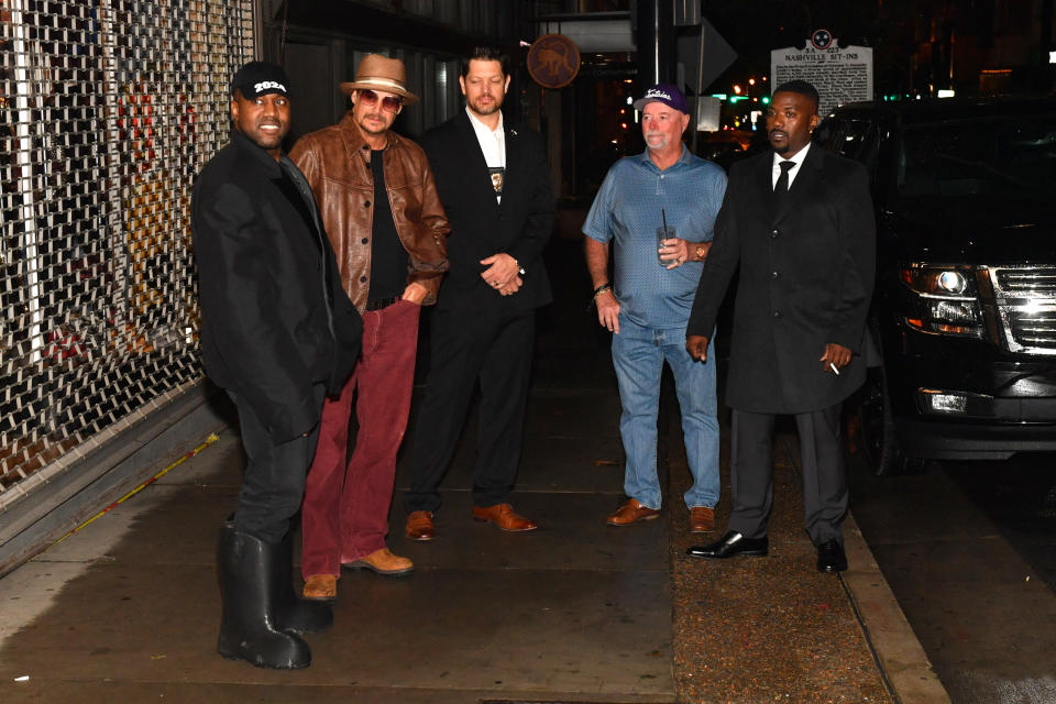 Kanye West, Kid Rock, and Ray J at a movie premiere.