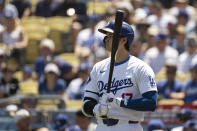 Los Angeles Dodgers' Shohei Ohtani looks on from the on-deck circle during the first inning of a baseball game against the New York Mets in Los Angeles, Sunday, April 21, 2024. (AP Photo/Kyusung Gong)