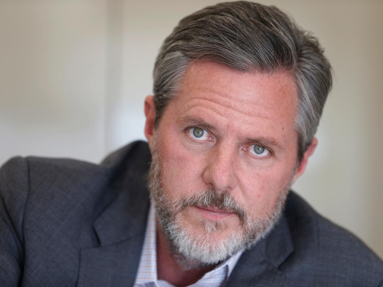 FILE - In this Nov. 16, 2016, file photo, Liberty University president Jerry Falwell Jr., poses during an interview in his offices at the school in Lynchburg, Va. In light of the coronavirus pandemic, Virginia's governor asked Falwell on Wednesday, March 25, 2020, to reconsider his decision to welcome students back to the Lynchburg campus this week after their spring break. (AP Photo/Steve Helber, File)