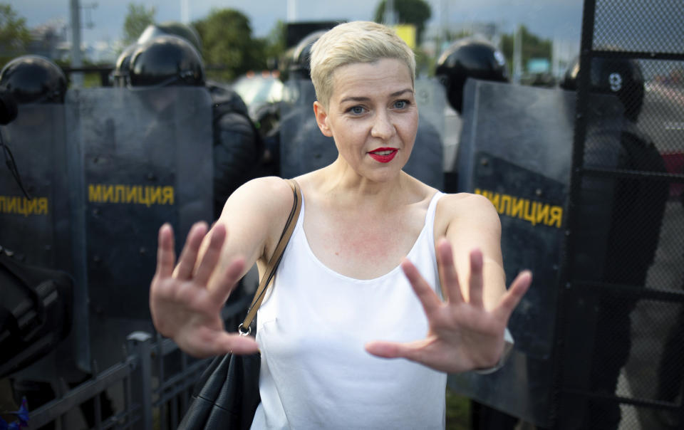 FILE - In this Aug. 30, 2020, file photo, Maria Kolesnikova, one of Belarus' opposition leaders, gestures during a rally in Minsk, Belarus. Kolesnikova, a professional flute player with no political experience, emerged as a key opposition activist in Belarus. She has appeared at protests of authoritarian President Alexander Lukashenko after he was kept in power by an Aug. 9 election that his critics say was rigged. (Tut.By via AP, File)