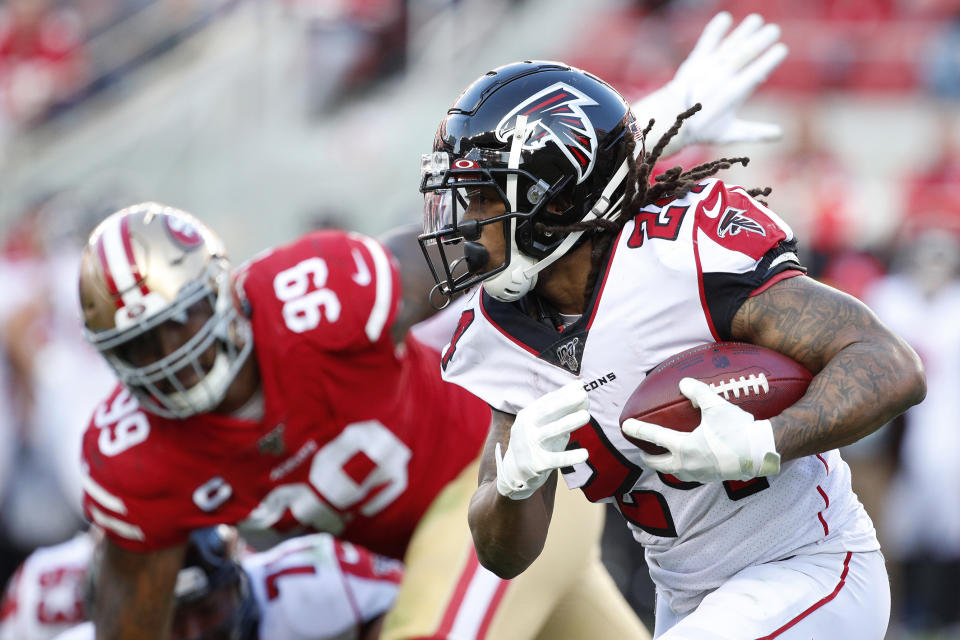 Atlanta Falcons running back Devonta Freeman (24) runs in front of San Francisco 49ers defensive tackle DeForest Buckner (99) during the second half of an NFL football game in Santa Clara, Calif., Sunday, Dec. 15, 2019. (AP Photo/Josie Lepe)