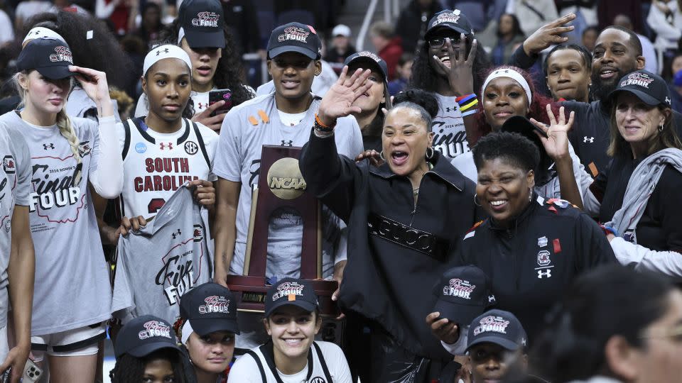 South Carolina head coach Dawn Staley celebrates with the team after beating the Oregon State Beavers in the Elite Eight round. - Andy Lyons/Getty Images