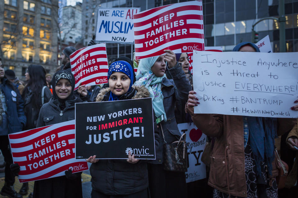A Muslim girl holds a sign&nbsp;during the protest&nbsp;against Trump's executive orders, including the banning of Muslims from certain countries from entering the United States.&nbsp;