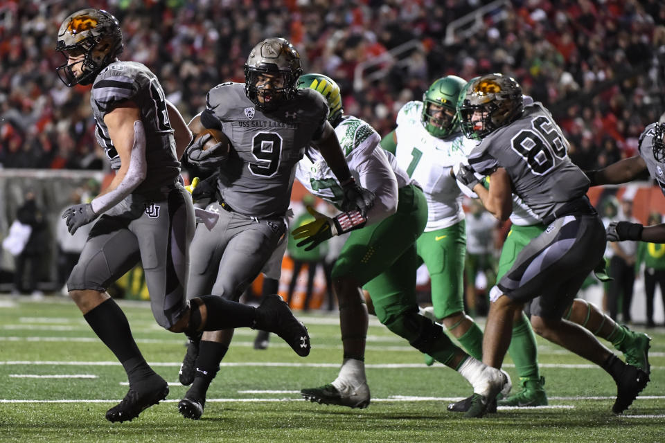 Utah running back Tavion Thomas (9) runs into the end zone during the second half of an NCAA college football game against Oregon Saturday, Nov. 20, 2021, in Salt Lake City. (AP Photo/Alex Goodlett)