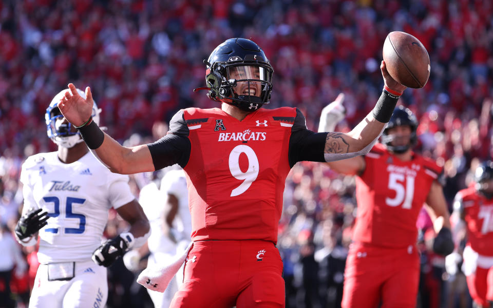 CINCINNATI, OHIO - NOVEMBER 06:   Desmond Ridder #9 of the Cincinnati Bearcats runs for a touchdown against Tulsa Golden Hurricane at Nippert Stadium on November 06, 2021 in Cincinnati, Ohio. (Photo by Andy Lyons/Getty Images)