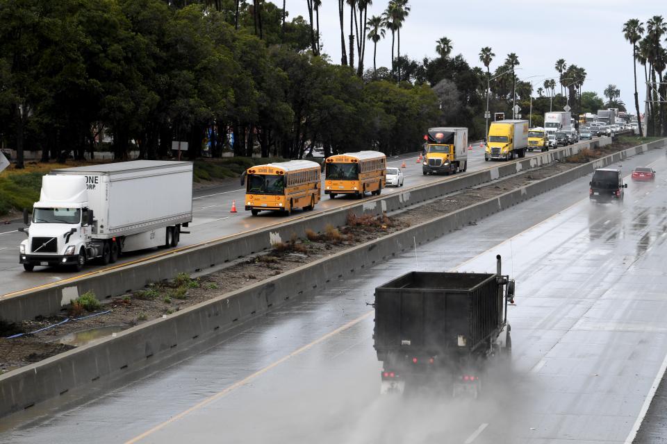 Traffic on southbound Highway 101 at California Street in Ventura merges into a single lane as the freeway floods after rain fell across Ventura County early Thursday.