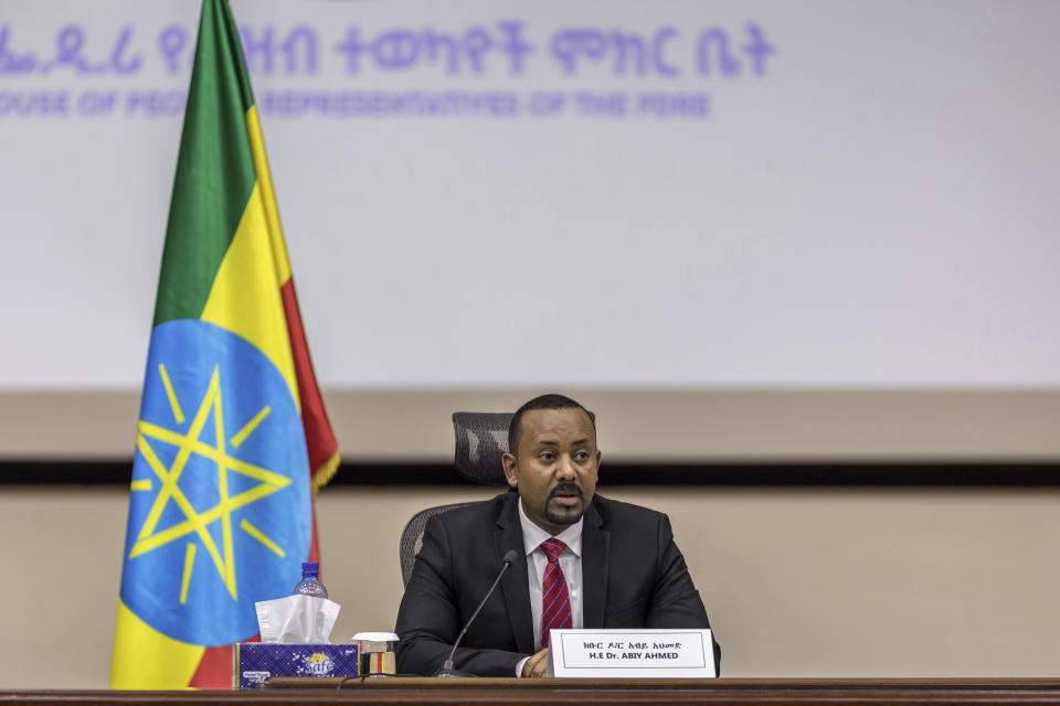 Ethiopia's Prime Minister Abiy Ahmed responds to questions from members of parliament at the prime minister's office in the capital Addis Ababa, Ethiopia Monday, Nov. 30, 2020. The fugitive leader of Ethiopia's defiant Tigray region on Monday called on Prime Minister Abiy Ahmed to withdraw troops from the region as he asserted that fighting continues "on every front" two days after Abiy declared victory. (AP Photo/Mulugeta Ayene)