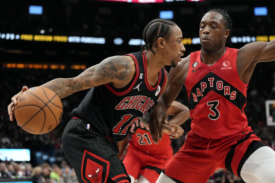 Toronto Raptors forward O.G. Anunoby (3) blocks Chicago Bulls forward DeMar DeRozan (11) during first-half NBA basketball game action in Toronto, Sunday, Nov. 6, 2022. (Frank Gunn/The Canadian Press via AP)