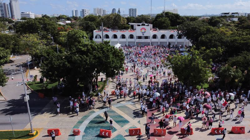 People take part in a protest against the electoral reform proposed by Mexican President Andres Manuel Lopez Obrador and in support of INE in Cancun Quintana Roo