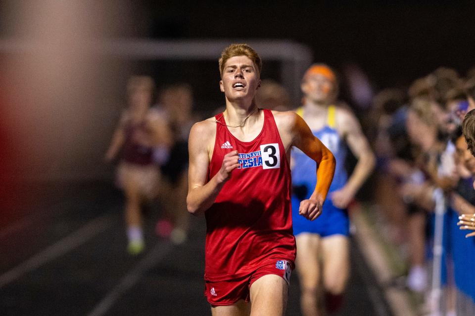 Martinsville High School’s Martin Barco crosses the finish line to win during a Flashes Showcase Miracle Mile race, Friday, April 14, 2023, at Franklin Central High School in Indianapolis.