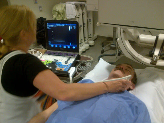 A technician performs an ultrasound of astronaut Chris Hadfield's spine, focusing on the vertebrae of his head and neck, a few days after Hadfield returned to Earth May 13, 2013.