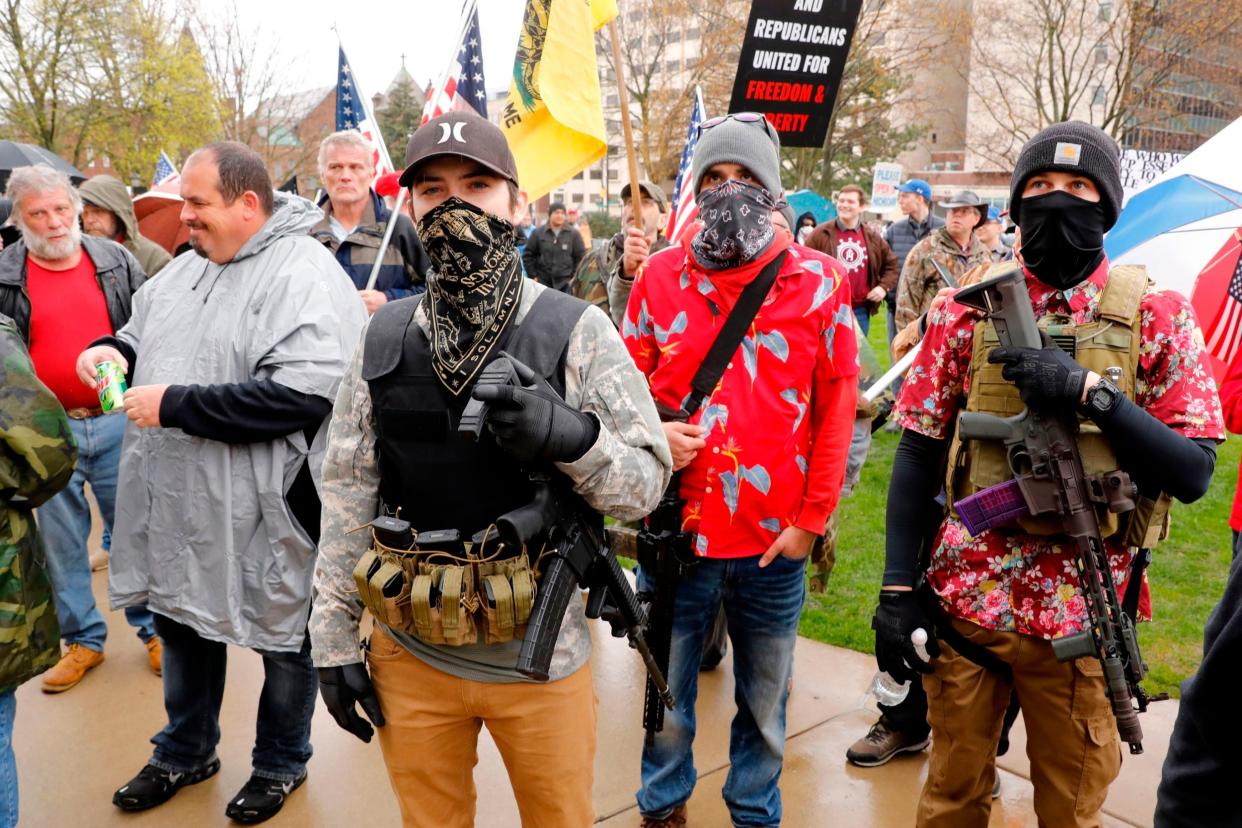 Armed protesters take part in a demonstration at the state Capitol in Lansing, Michigan against lockdown measures during the coronavirus pandemic: AFP via Getty Images