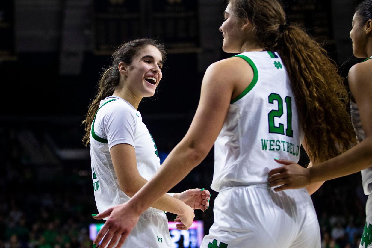 Notre Dame's Sonia Citron, left, celebrates with Maddy Westbeld (21) during the second half of a first-round college basketball game against Southern Utah in the NCAA Tournament, Friday, March 17, 2023, in South Bend, Ind. (AP Photo/Michael Caterina)