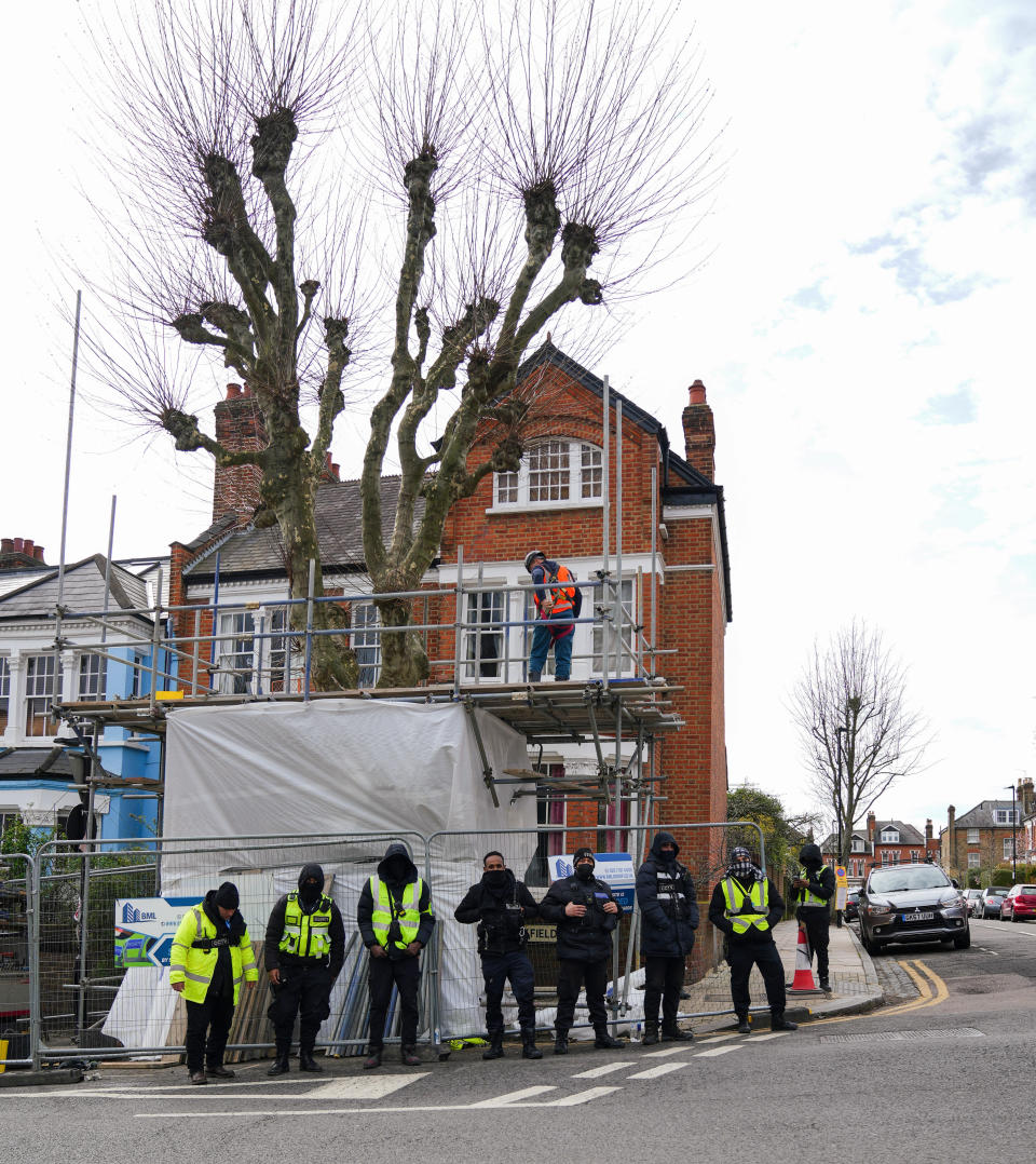 Haringey council was accused of using 'underhand tactics' after residents were woken before dawn by security guards and tree surgeons taking possession of a tree in north London. (SWNS)