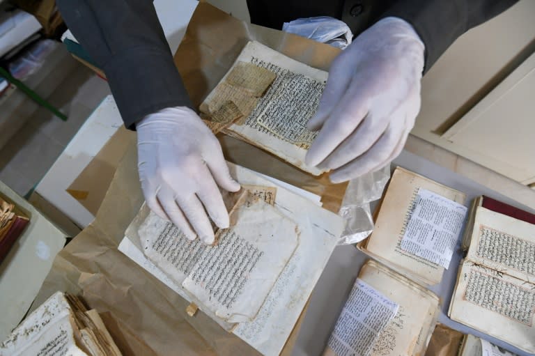 Said al-Barouni prepares to scan old manuscripts at his library (FETHI BELAID)