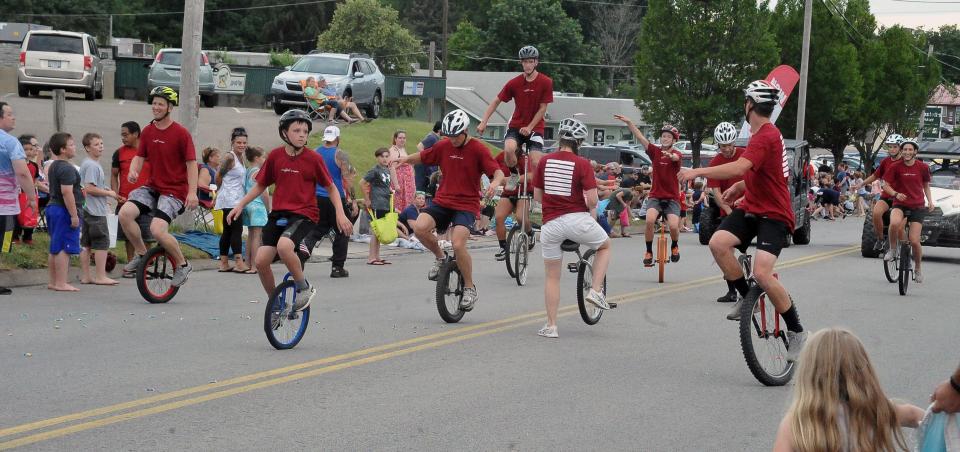 Unicycles glide down the street during a previous July 4 parade in Orrville. The Independence Day Parade in Orrville this year kicks off a five-day celebration Wednesday at 7 p.m. Parade line-up begins at 5 p.m.