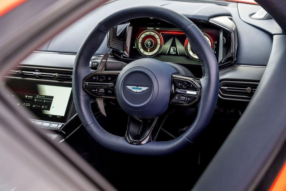 the steering wheel and dashboard of a car