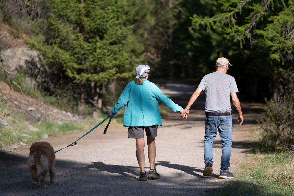 Along with the service dog, Brassy, Suzi and Jack Hanna take their daily walk along the Bigfork Nature Trail near their Montana home on May 2. 