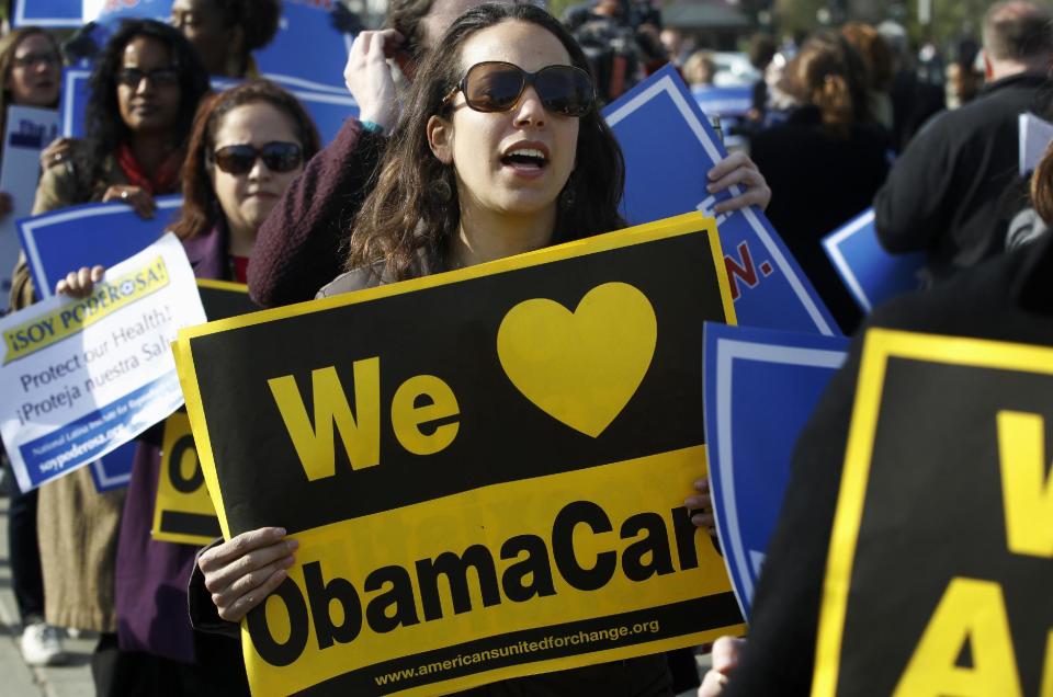 Supporters of health care reform stand in front of the Supreme Court in Washington, Wednesday, March 28, 2012, on the final day of arguments regarding the health care law signed by President Barack Obama. (AP Photo/Charles Dharapak)