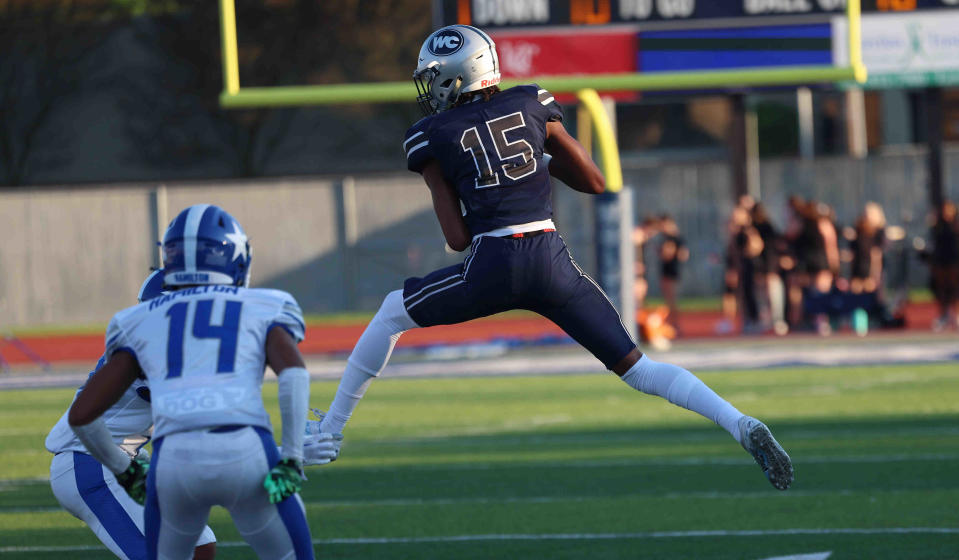 Then-West Clermont wide receiver Chris Henry Jr. catches a pass during their football game against Hamilton Friday, Aug. 19. Henry Jr. has since enrolled at Withrow High.