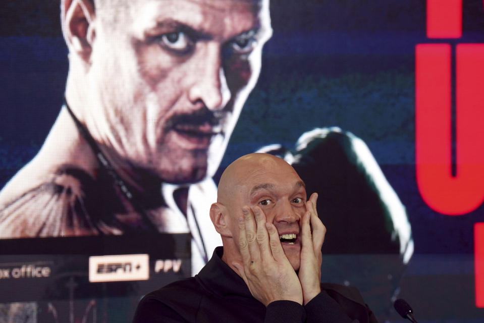 British professional boxer Tyson Fury gestures during a news conference at the The Mazuma Mobile Stadium, Morecambe, England, Wednesday, April 10, 2024. Tyson Fury says size will count for everything in his fight with Oleksandr Usyk to crown the first undisputed heavyweight champion since 2000. (Owen Humphreys/PA via AP)